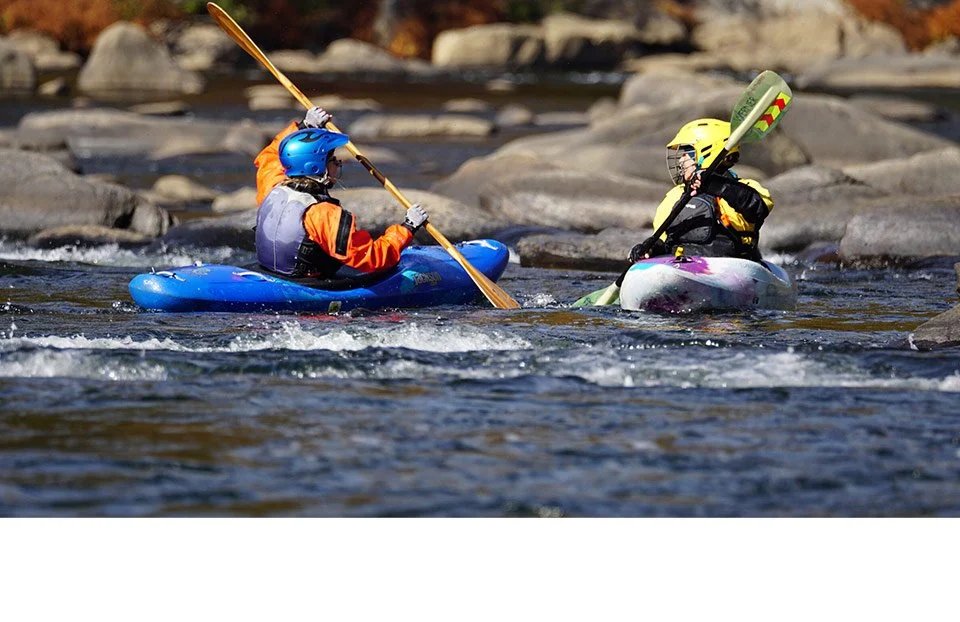 Two Keel-Haulers paddlers practicing together on the river